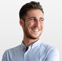man is smiling in shirt