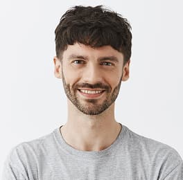 man is smiling in t-shirt